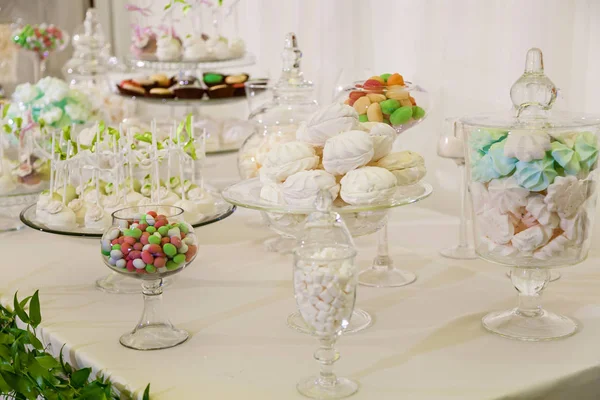 Candy bar for a wedding party. Colorful table with sweets for the wedding,Sweet table at the wedding celebration