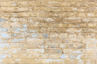 Tuğla duvar. Tuğla duvar tuğla farklı boyutu ve şekli kum rengi mavi renk ilavesi ile.