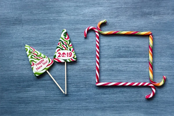 Colored Candy Lollipops New Year Sweets Blue Background Christmas Tree — Stock Photo, Image