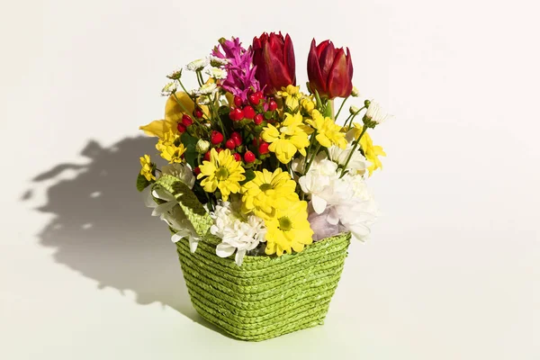 A beautiful arrangement of fresh flowers tulips, archdeus, chrysanthemums and roses on a white background. Flowers for the holiday of March 8, birthday, February 14