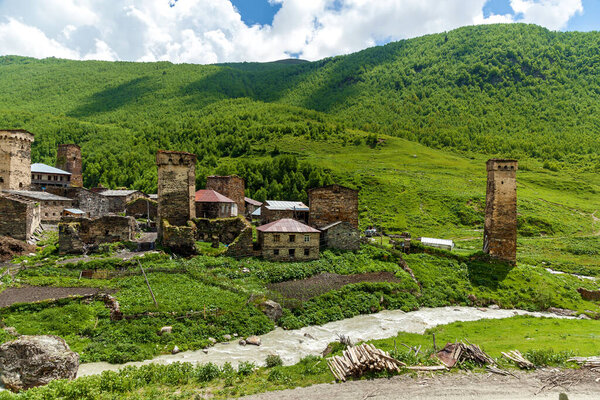 Georgian village in the mountains, Svaneti. Svan towers. An old abandoned village. Among the high green mountains.