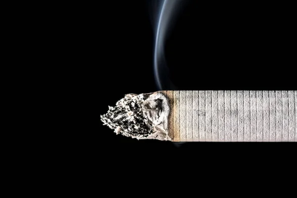 Burning Smoldering Cigarette Close Beautiful Smoke Isolated Black Background — Stock Photo, Image