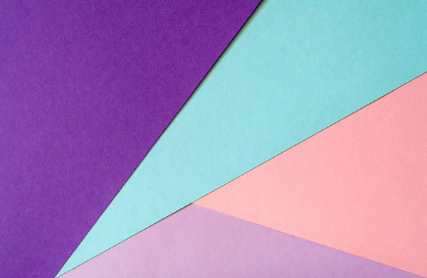 Mehrfarbiger Papierhintergrund in sanften Blau-, Violett-, Flieder- und Korallenfarben. — Stockfoto