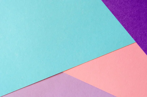 Veelkleurige papier achtergrond in zacht blauw, Violet, lila en koraal kleuren. — Stockfoto