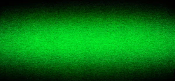 良い品質多孔質グランジ緑の色の段ボール紙のテクスチャ側面にビネット調光とのクローズアップ — ストック写真