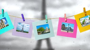 Paris 'in yaz aylarındaki ana manzarasının yaratıcı yavaş çekim videosu. Üzerinde mandallar olan bir iple kışın Eyfel Kulesi ile Paris' in panoramasının önünde..