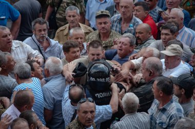 19 Haziran 2018. Kiev, Ukrayna. Çatışmalar Ukrayna parlamento dışında. Madenci, Chornobyl temizlik işçileri ve Sovyet-Afgan Savaşı gazileri gibi protestocular geliştirilmiş devlet destek talep etti..