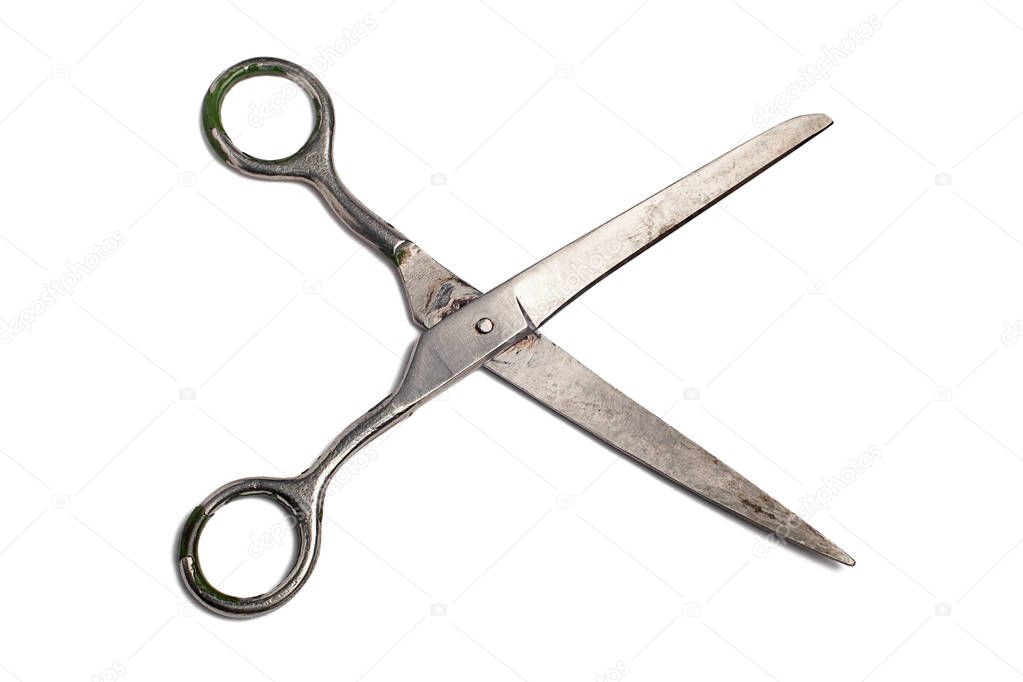 Wide open metallic scissors isolated on a white background
