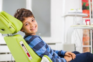 Little boy is ready for dentist.  clipart