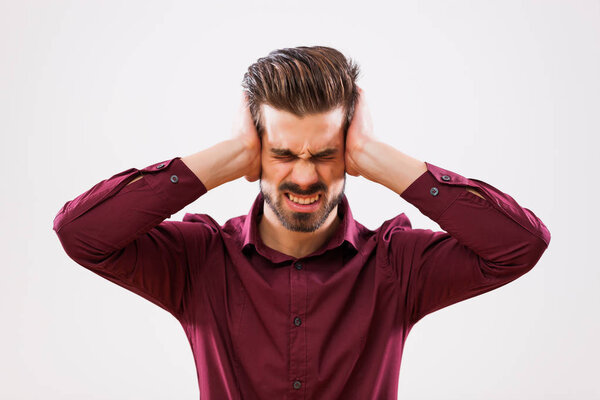 Portrait of young businessman who is under stress