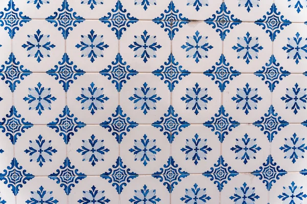 Traditional Portuguese tiles from a building in a street in Lisbon.