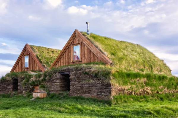 Traditional northern scandinavian houses with turf and grass, scenic view of the building in summer time, Iceland