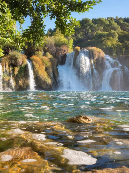 Waterfall in Krka National Park, famous Skradinski buk, one of the most beautiful waterfalls in Europe and the biggest in Croatia, amazing nature daytime landscape, vertical image