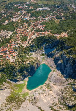 Imotski Blue Lake (Modro jezero) in limestone crater, aerial view. Nature summer landscape, popular tourist destination in Dalmatia, outdoor travel background, vertical image, Croatia clipart