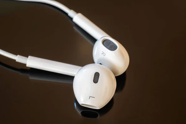 White close up headphones on black isolated background — Stock Photo, Image