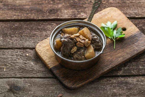 Thai Muslim beef curry or massaman curry served in copper pan