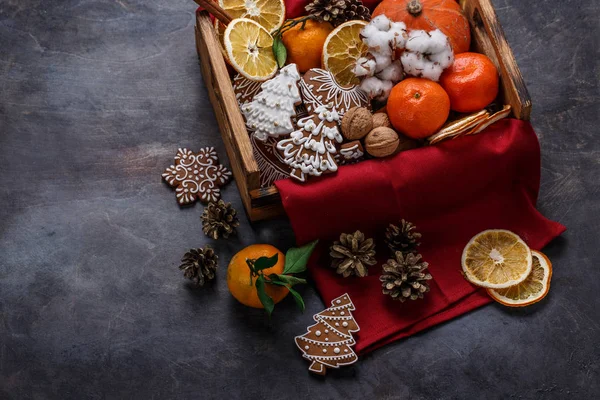 Christmas decoration with gingerbread cookies, dry oranges, nuts and tangerines, copyspace — Stock Photo, Image