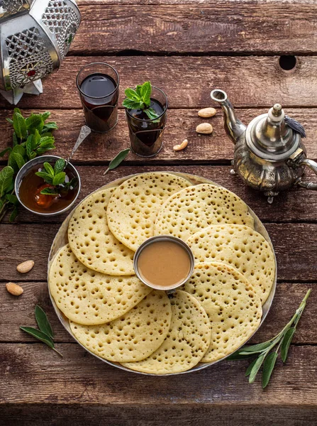 Baghrir with honey, almond sauce and mint tea
