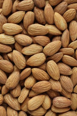 Rastgele yerleştirilmiş büyük soyulmuş bademlerin arkaplanı