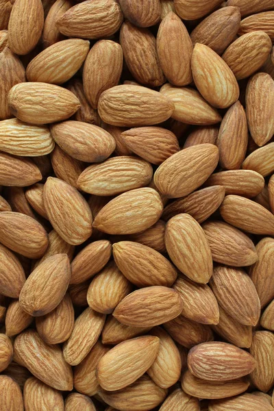 Rastgele yerleştirilmiş büyük soyulmuş bademlerin arkaplanı