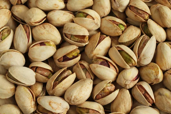 Background Salted Pistachio Nuts Situated Arbitrarily — Stock Photo, Image