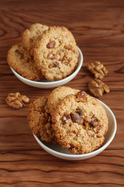 Oatmeal Cookies Walnuts Raisins Small Saucers Standing Wooden Table Closeup — Stock Photo, Image