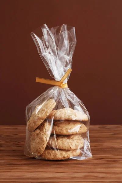 Almond Cookies Transparent Bags Wooden Table Closeup — Stock Photo, Image