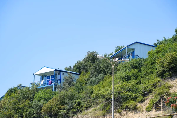 Houses on the mountain for tourists. A house among the trees.