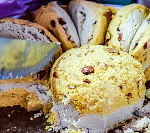 Cake with nuts. Slice the cake. Indian sweets.