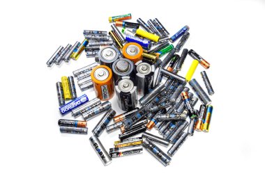 Krasnodar, Russia - February 4, 2019: Saline and alkaline batteries, energy source for portable technology. AAA and AA batteries clipart