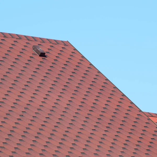 Decorative metal tile on a roof — Stock Photo, Image