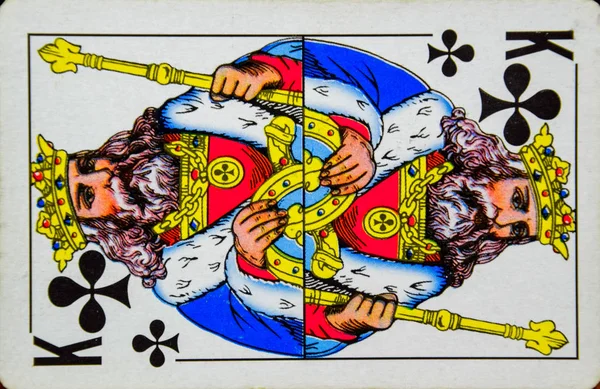 Card playing king of clubs, suit of clubs.
