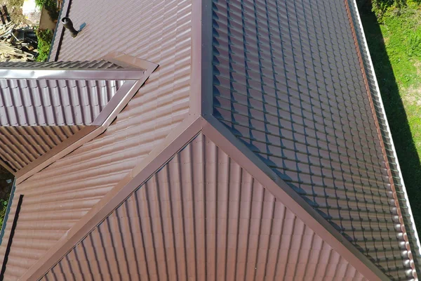 A view from above on the roof of the house. The roof of corrugated sheet. Roofing of metal profile wavy shape — Stock Photo, Image