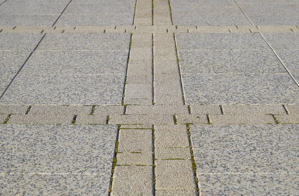 Capire le lastre di pavimentazione nel quadrato. Sfondo di lastre di pavimentazione. Texture di prodotti lapidei — Foto Stock