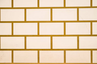 Arka plan dokusu beyaz tuğla ve sarı çimento. Taş duvar.