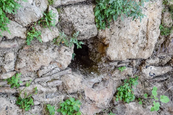Hole in the wall of limestone