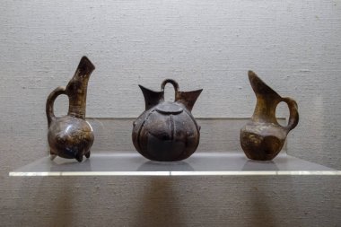 Ancient pottery, vessels and amphorae in Antalya Museum of Antiquities. clipart