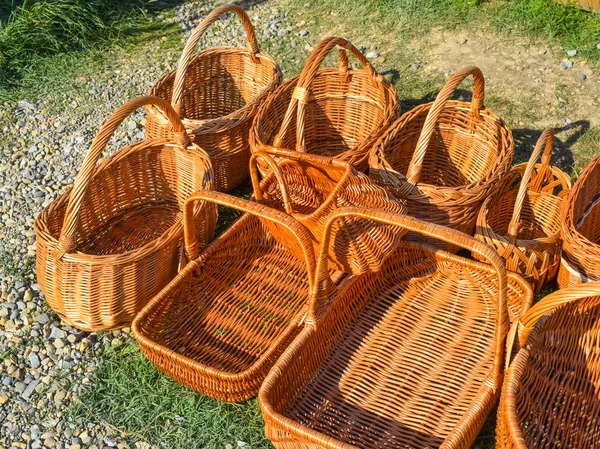 Several wicker baskets on the ground