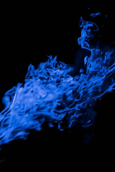 Blue flame. Fire. Burning of rice straw at night.