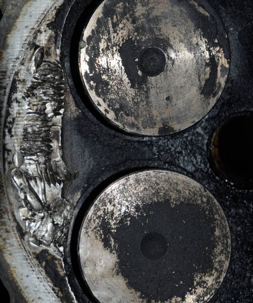 Valve in a deposit on the removed cover of the engine valve box.