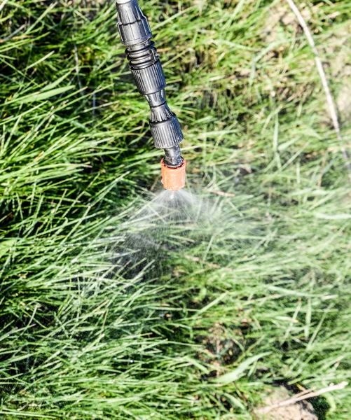 Spraying herbicide from the nozzle of the sprayer manual — Stock Photo, Image