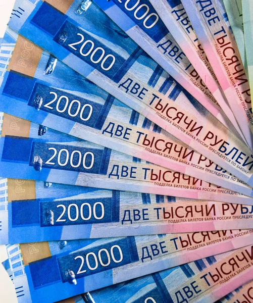 Russian money banknotes in nominal value of two thousand. New tickets of the bank of Russia. Russian money. — Stock Photo, Image