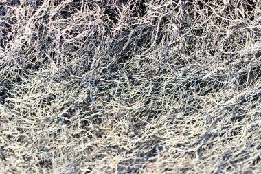 Arka plan doku çim, çim kül yanmış.