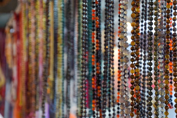 Indian beads and jewelry on the counter in store. — Stock Photo, Image