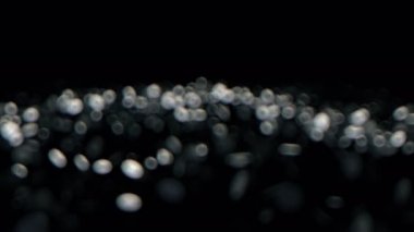 Soyut Noel arka plan bulanık defocused bokeh ışıkları ile yüksek kaliteli animasyon gümüş. Sorunsuz döngü