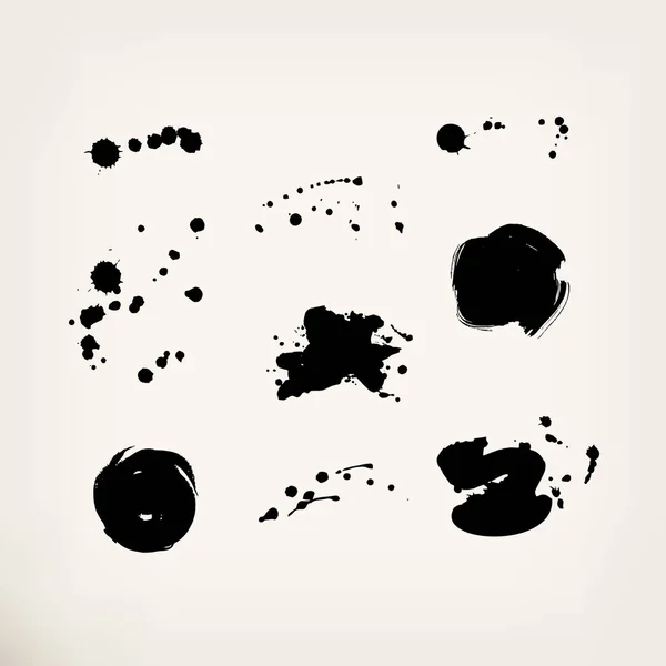 Ensemble de taches noires — Image vectorielle