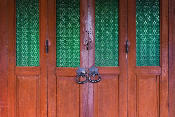 Old Folding Wooden Doors Black Metal Handles Green Pattern Glass — Stock Photo, Image