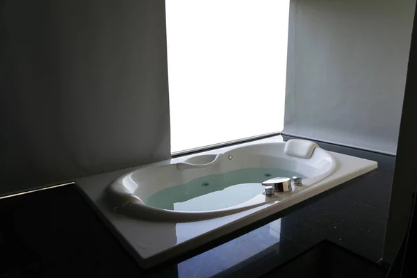 White massaging jetted bathtub with blank white background — Stock Photo, Image