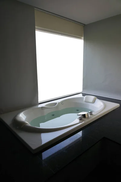 White massaging jetted bathtub with curtains and blank white background — 스톡 사진