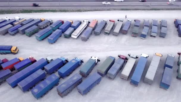 Aerial Top View of White Semi Truck with Cargo Trailer Parking with Other Trucks on Special Parking Lot. Shot on Phantom 4K UHD Camera. — Stock Video